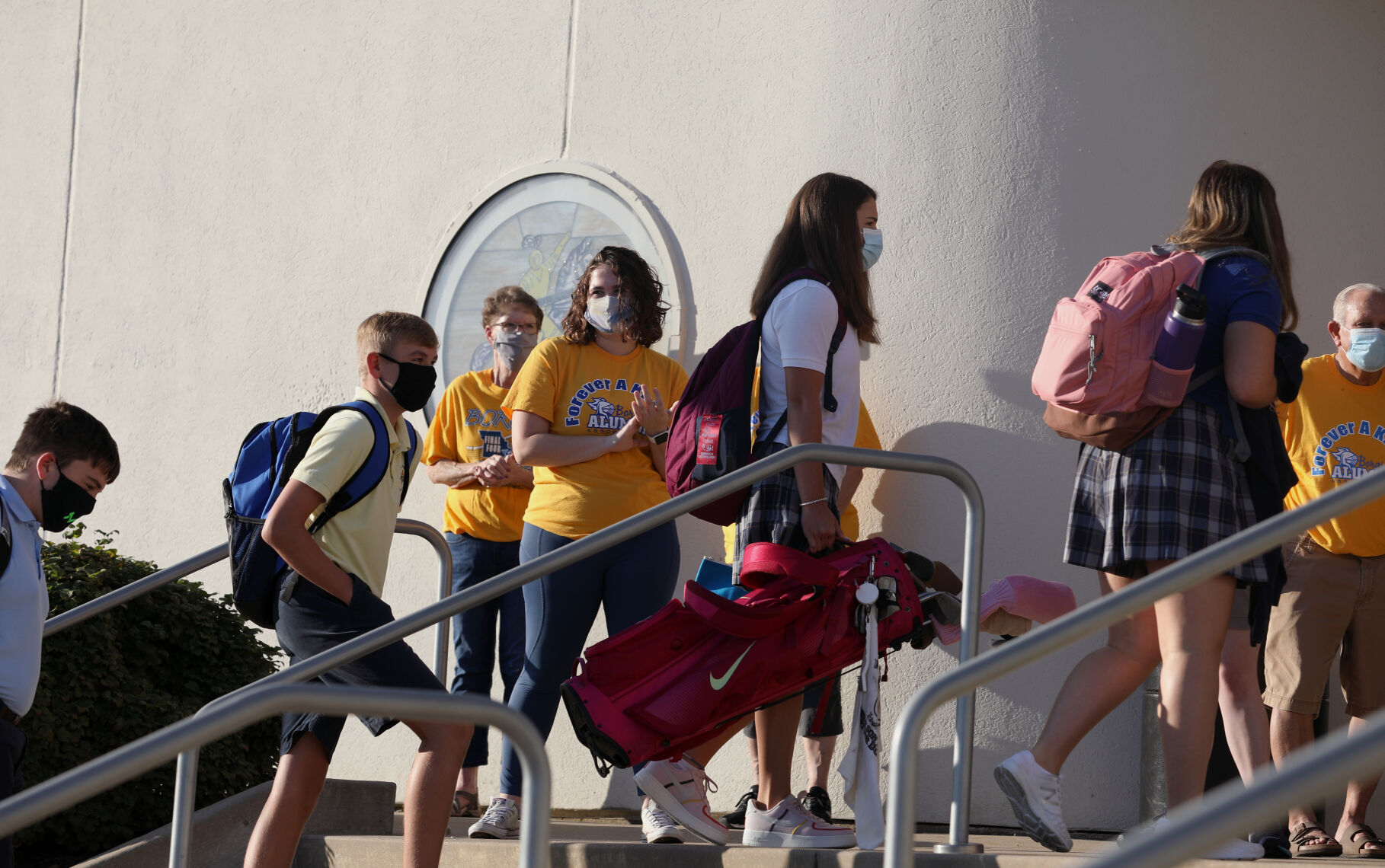 Students climb the stairs